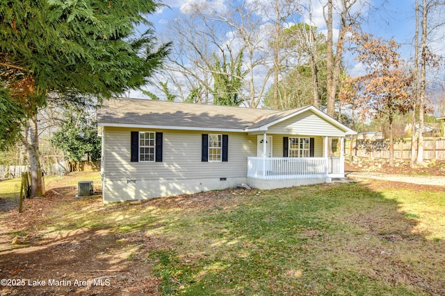 view of front of property featuring central AC, covered porch, and a front lawn