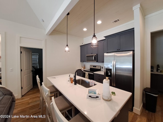 108 Williamson Trce, Tallassee, AL 36078 - kitchen with a center island with sink, a breakfast bar, decorative light fixtures, and appliances with stainless steel finishes