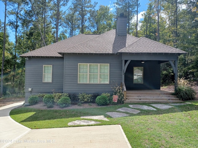 view of front of home featuring a porch and a front yard