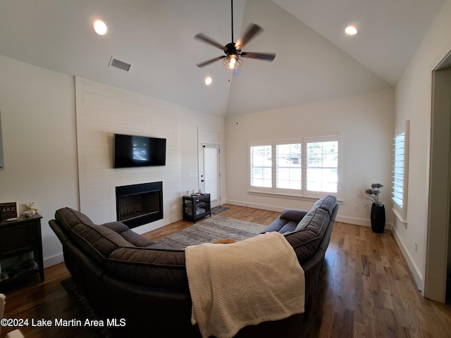 108 Williamson Trce, Tallassee, AL 36078 - living room featuring a large fireplace, hardwood / wood-style flooring, high vaulted ceiling, and ceiling fan
