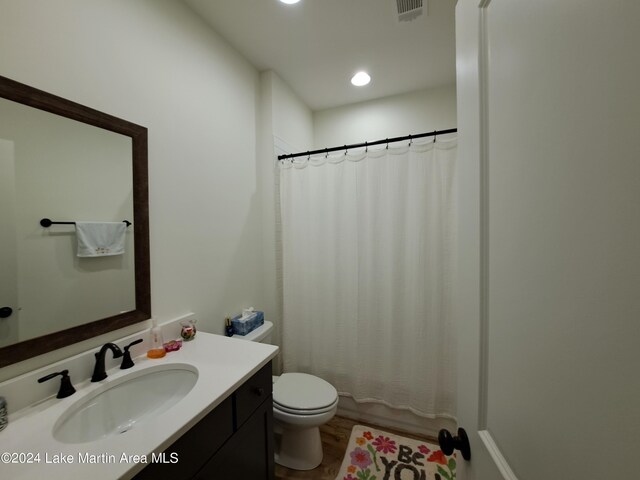 108 Williamson Trce, Tallassee, AL 36078 - bathroom with hardwood / wood-style floors, vanity, and toilet