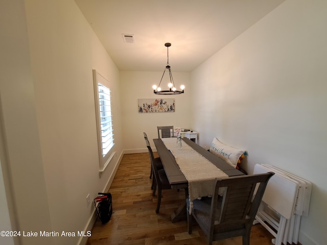 108 Williamson Trce, Tallassee, AL 36078 - dining area with a notable chandelier and dark wood-type flooring