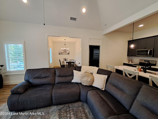 108 Williamson Trce, Tallassee, AL 36078 - living room featuring a chandelier, hardwood / wood-style floors, lofted ceiling, and sink
