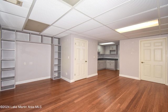 basement featuring dark hardwood / wood-style floors