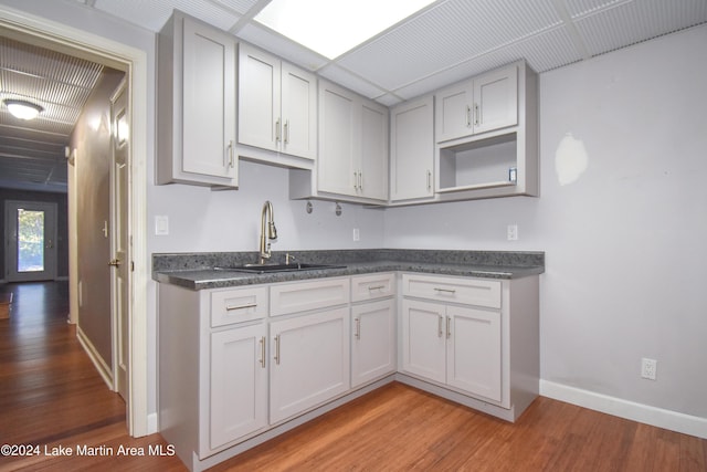 kitchen with sink and light hardwood / wood-style floors