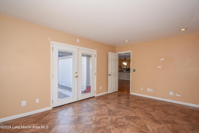 empty room featuring french doors