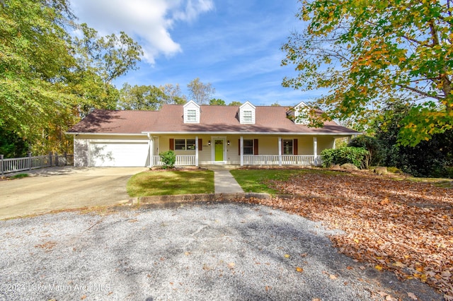 view of front of house featuring a garage and covered porch