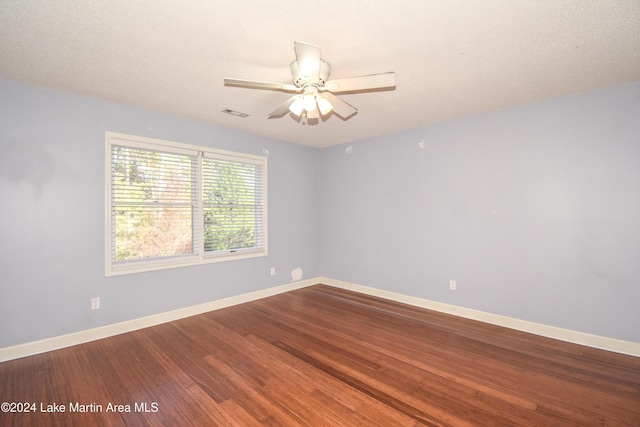 unfurnished room featuring ceiling fan, a textured ceiling, and hardwood / wood-style flooring