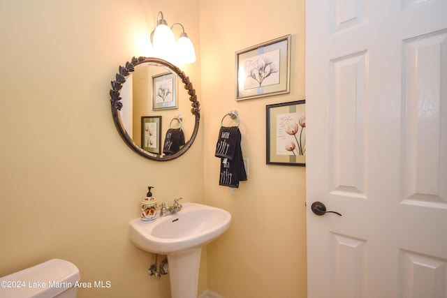 bathroom with toilet and sink