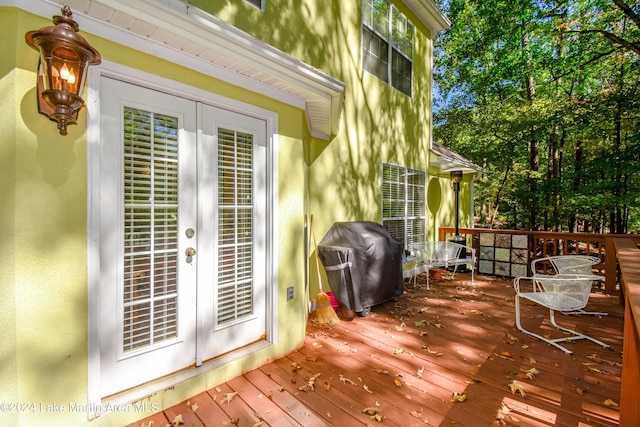 wooden terrace with french doors and grilling area