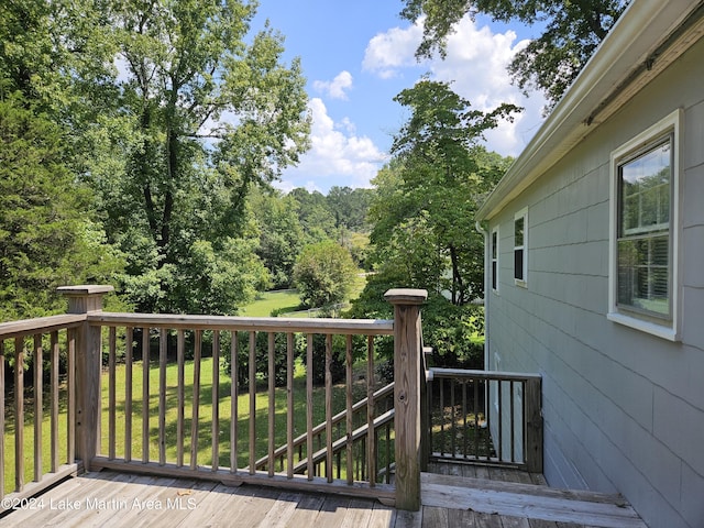 deck featuring a lawn