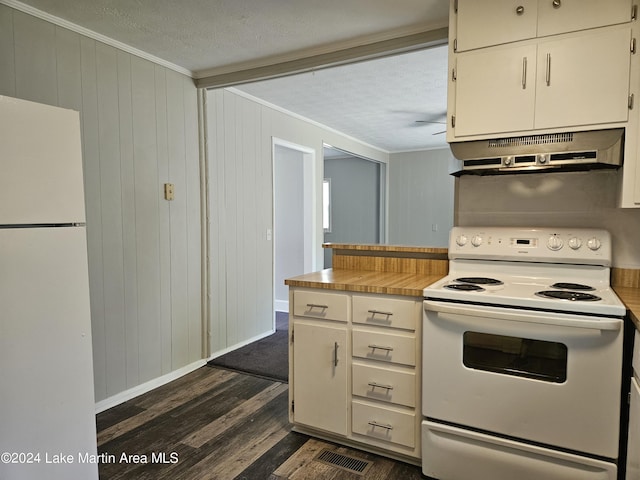 kitchen featuring a textured ceiling, white appliances, crown molding, dark wood-type flooring, and range hood