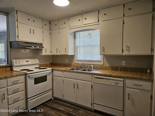 kitchen with white cabinetry, sink, dark wood-type flooring, and white appliances