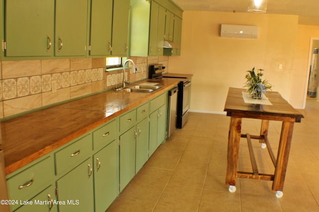 kitchen featuring green cabinets, sink, range with electric cooktop, and a wall unit AC