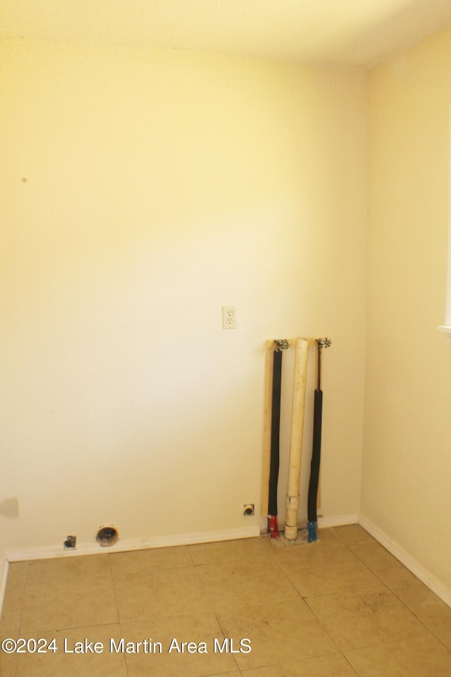 washroom with tile patterned floors