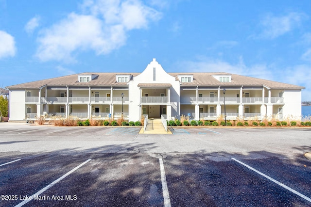 view of property featuring uncovered parking