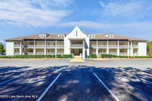 view of property with uncovered parking