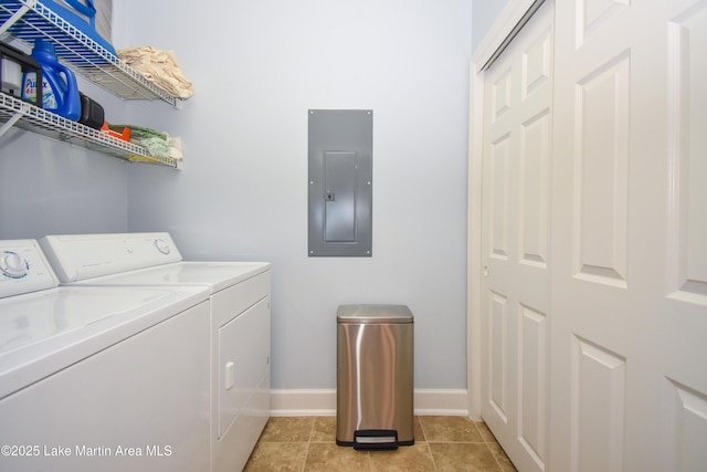 washroom featuring laundry area, light tile patterned floors, electric panel, baseboards, and separate washer and dryer