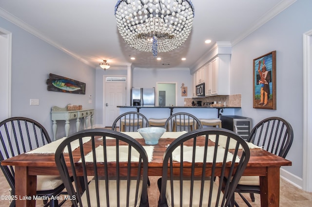 dining area featuring a notable chandelier, recessed lighting, baseboards, and crown molding