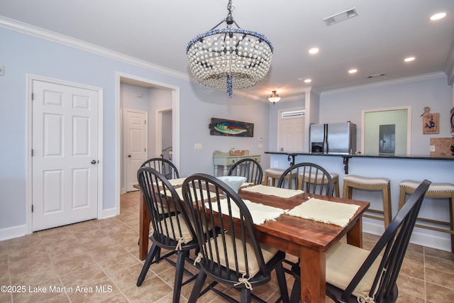 dining room featuring baseboards, visible vents, crown molding, and recessed lighting