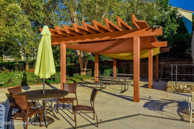 view of patio featuring outdoor dining space and a pergola