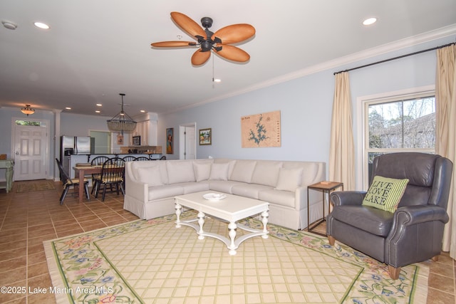 living area with ornamental molding, tile patterned flooring, a ceiling fan, and recessed lighting