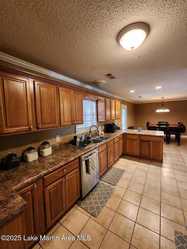 kitchen with light tile patterned flooring, pendant lighting, sink, ornamental molding, and stainless steel dishwasher