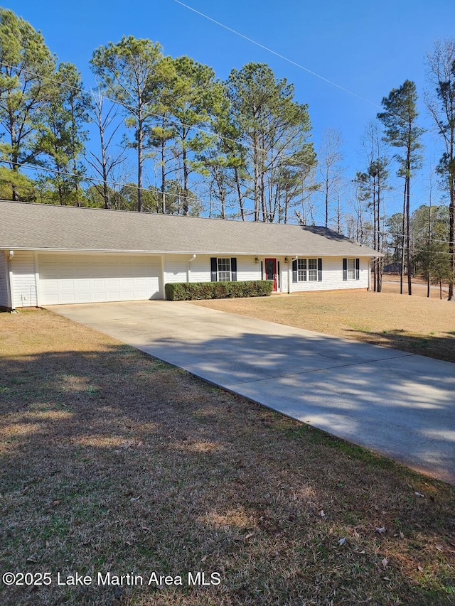 ranch-style house with a garage and a front lawn