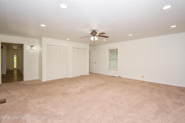 485 Ridgeview Dr, Alexander City, AL 35010 - unfurnished bedroom featuring two closets, light carpet, recessed lighting, and ceiling fan