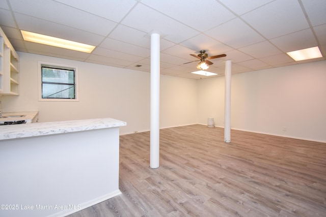 485 Ridgeview Dr, Alexander City, AL 35010 - below grade area with light wood finished floors and a drop ceiling