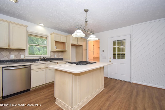 485 Ridgeview Dr, Alexander City, AL 35010 - kitchen featuring stainless steel dishwasher, wood finished floors, gas stovetop, tasteful backsplash, and a kitchen island