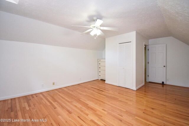 485 Ridgeview Dr, Alexander City, AL 35010 - additional living space featuring vaulted ceiling, light wood finished floors, ceiling fan, and a textured ceiling