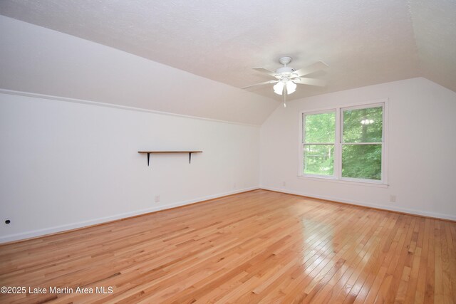 485 Ridgeview Dr, Alexander City, AL 35010 - additional living space featuring vaulted ceiling, hardwood / wood-style floors, ceiling fan, and a textured ceiling