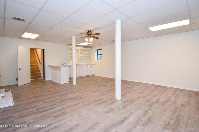 485 Ridgeview Dr, Alexander City, AL 35010 - basement with light wood-style flooring, stairway, and a paneled ceiling