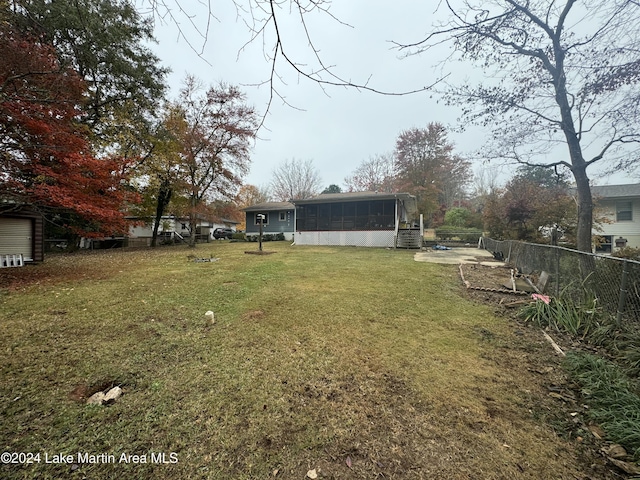 view of yard featuring a sunroom