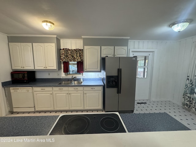 kitchen with white dishwasher, plenty of natural light, stainless steel fridge with ice dispenser, and sink