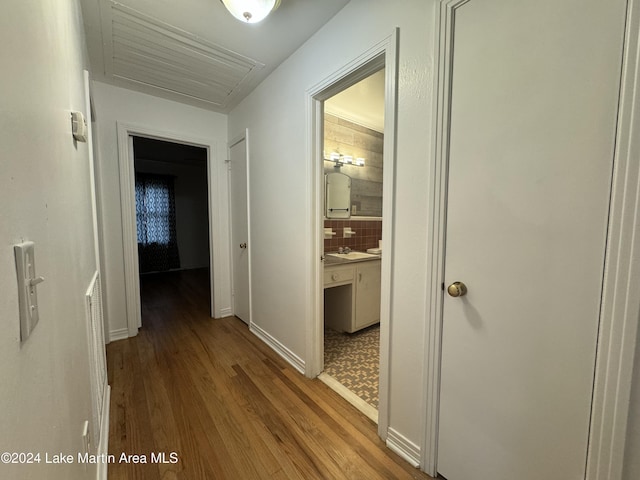 corridor with light wood-type flooring