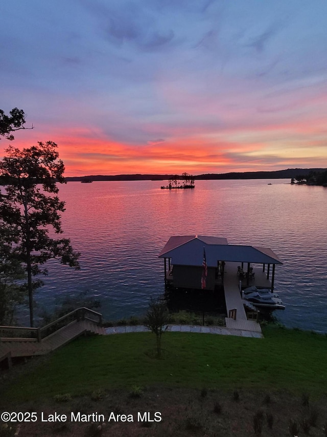 dock area featuring a yard and a water view