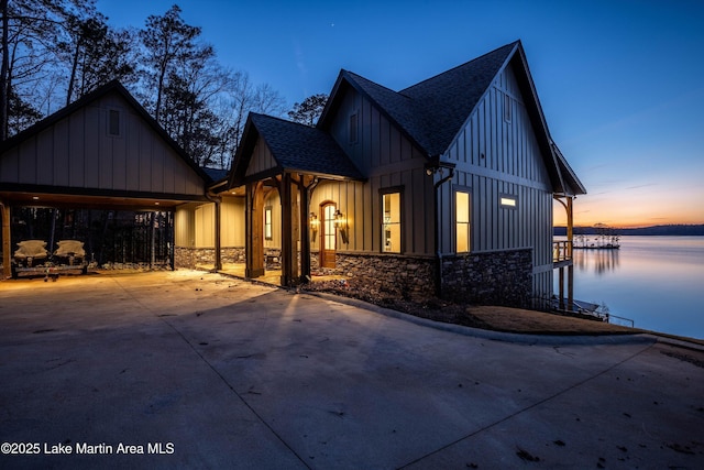 view of front of home with a water view