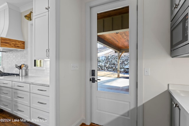 entryway with dark hardwood / wood-style floors