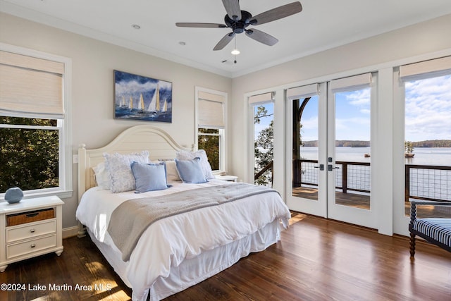 bedroom featuring a water view, dark hardwood / wood-style floors, french doors, access to exterior, and ornamental molding