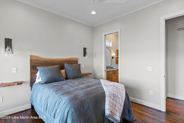 bedroom with dark hardwood / wood-style floors, ceiling fan, crown molding, and ensuite bathroom