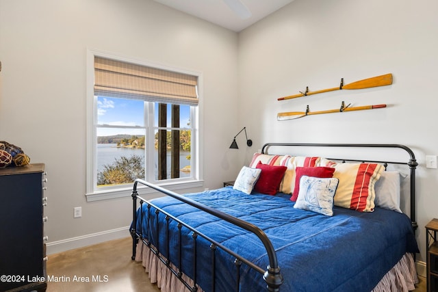 bedroom featuring a water view