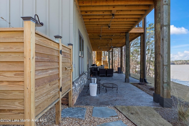 view of patio / terrace with a water view