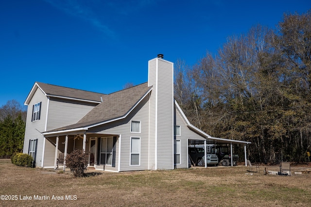 view of property exterior featuring a carport, a yard, and a porch