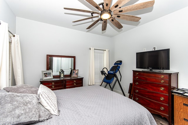 bedroom with light wood-style floors and a ceiling fan