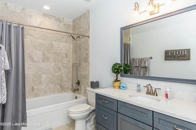 full bath with toilet, shower / tub combo with curtain, and vanity