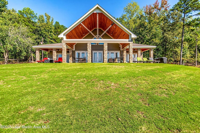 view of front of house featuring french doors and a front yard