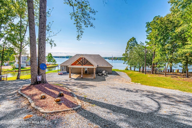 view of front of property with a water view