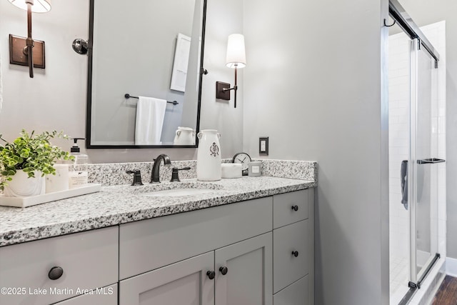 bathroom with vanity and walk in shower